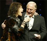 Craig Barrett, CEO of Intel sings with Steven Tyler of Aerosmith as he delivers the keynote address of the Consumer Electronics Show on Thursday at the Las Vegas Hilton.