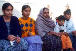 Tsunami survivor Paramjit Kaur with her children at Sangowal village in Ludhiana district on Thursday