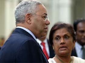US Secretary of State Colin Powell chats with Sri Lankan President Chandrika Kumaratunga during a visit to Colombo