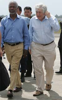 UN Secretary General Kofi Annan and World Bank President James Wolfensohn arrive at an airport after inspecting damages in the tsunami-hit cities of Meulaboh and Banda Aceh