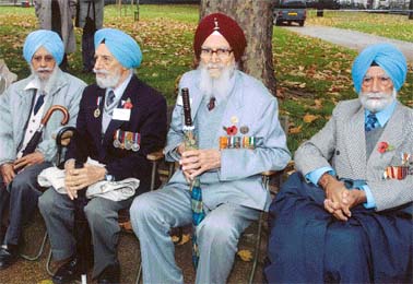 Sepoy Jaswant Singh (Sikh Regiment), Hav. Rajinder Dhad (ASC), Hav Mangal Singh (Signals) and Lt. Col. Chanan Singh Dhillon at the second anniversary re-union of the Memorial Gates Trust in London.
