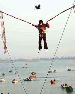 Airborne sans wings: A girl enjoys the thrill of height at a trampoline jump