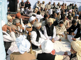 Representatives of 360 villages participating in a panchayat to protest against the imposition of house tax on rural areas at Shadipur village in the Capital