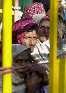 Women supporters of the Congress from Haryana await to meet party President Sonia Gandhi outside her residence in New Delhi