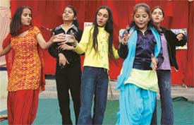 Students of Shivalikwala Doon School dance to the tunes of DJ at the school fete