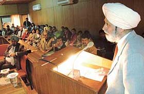 Mr H.S. Brar, president, Punjab State Consumer Disputes Redressal Commission, addresses the gathering at ICSSR complex, Panjab University, Chandigarh