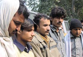 Five gangsters, involved in a double murder-cum-robbery case, just before facing the court in the Capital