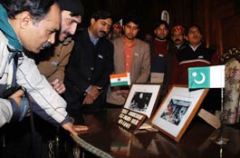 Pakistani journalists gather around the India-Pakistan Agreement table at Raj Bhavan in Shimla 