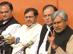 Janata Dal (U) leader Nitish Kumar, BJP leader Arun Jaitley, Sharad Yadav and Digvijay Singh announce seat-sharing arrangement for Bihar and Jharkhand Assembly poll in New Delhi on Monday. 
