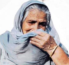 Gurdev Kaur narrates her experience of surviving the tsunami disaster at Kanech village near Sahnewal here on Monday
