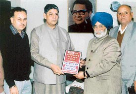 Mr Rakesh Pandey, Minister of Technical Education, releases a poster against drugs at a function organised by the Shaheed Memorial International Society on Monday
