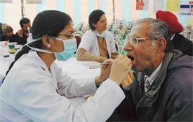 Doctors from Christian Dental College examine patients during a free dental and eye camp organised in cooperation with the Ludhiana Car Dealers Association