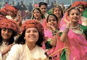 Schoolgirls presenting a folk dance at the press preview for the Republic Day Parade at Rajpath in the Capital