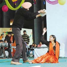 Artistes of the Punjabi Cultural Promotion Council present a play focusing on the plight of women during the Lohri celebrations, organised by the Malwa Sabyacharak Manch in Ludhiana on Tuesday