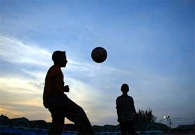 Children play soccer at a relief camp in Port Blair on Tuesday