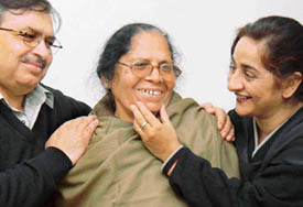 Mrs Avinash Rani Sagar with her son, Anil, and daughter-in-law, Binu, after arriving at their Sector 41 house in Chandigarh.