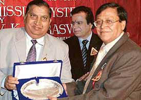 Dr S.K. Salwan, Vice-Chancellor of the Punjab Technical University, Jalandhar, a memento to Dr V.K. Sarswat, Director RCI, Hyderabad (right) at a function in an Engineering Institute at Rajpura on Wednesday. 