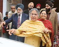 Gursharan Kaur (centre), wife of Prime Minister Manmohan Singh, with sister-in-law Pritam Kaur (right) and her husband Vidya Ratan Singh (left), at their Behala residence in Kolkata on Wednesday.
