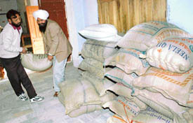 Villagers donate in kind for tsunami victims at Mohali on Thursday. 