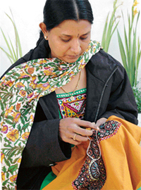 Anu Patel embroiders a piece at a demonstration organised at Karigiri Craft Bazar in Ludhiana on Thursday