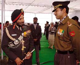 Newly designated Army Chief J.J. Singh has a word with Olympic silver medalist shooter Major Rajyavardhan S. Rathore during the GOC-in-C Western Command parade in New Delhi on Thursday. 