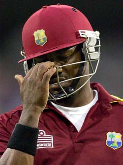 Brian Lara reacts as he walks off the field after being dismissed for 58 runs during the one-day match against Australia