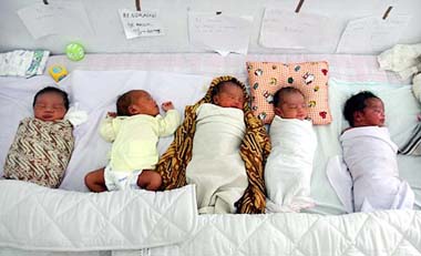 Babies born after the devastating tsunami sleep on a bed at a hospital in Banda Aceh 
