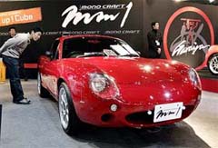 A visitor checks out moroCRAFT mm1 lightweight sports coupe during the Tokyo Auto Salon 2005 at Makuhari, near Tokyo
