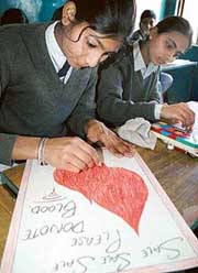 Students take part in a painting competition at Government Model High School, Sector 42, Chandigarh, on Saturday.