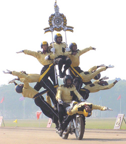 Daredevils from Army exhibit their skills on motorcycle at the Army Day Parade in the Capital on Saturday. 