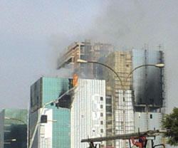 A plume of smoke can be seen billowing out of the DLF building in Gurgaon. 