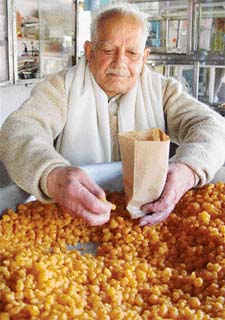 Rebel BJP candidate Master Shiv Prasad busy at his tea shop in Ambala on Saturday