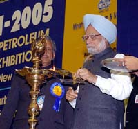 Prime Minister Manmohan Singh lights the traditional lamp at Petrotech 2005 in New Delhi on Sunday.