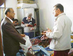 Policemen inspect the ransacked room at Mr D.L. Jindals house in Panchkula