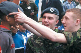 Foreign cadets adjusting the cap of an Indian cadet at the NCC Republic Day camp in the Capital.