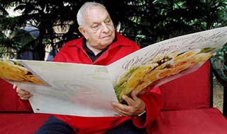 Russi Modi holds a big card from a well-wisher on his 87th birthday at his South Kolkata residence on Monday.