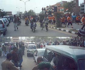 A vehicle fitted with eight loudspeakers forms part of the cavalcade of Congress nominee Sumita Singh as she goes to file her nomination in Karnal on Monday; and (below) a view of the huge cavalcade taken out in violation of the Model Code of Conduct.
