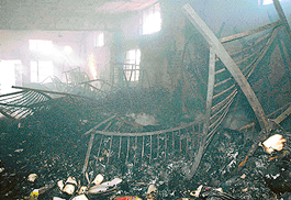Remains of the first floor of Instant Remedies Pvt. Ltd., a pharmaceutical manufacturing unit, that was gutted in fire in Gholumajra village near Lalru on Tuesday. 
