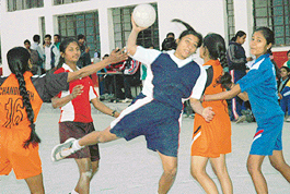 Renu Saini of the Sector 19 Coaching Centre attempts a shot against the Sector 23 Coaching Centre during the Chandigarh Senior Handball Championship at DAV Senior Secondary School, Sector 8, Chandigarh, on Tuesday.