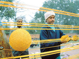 The city has become the biggest kite and dore centre in India. Workmen prepare dore to meet the seasons demand.