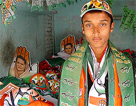 A vendor sells campaign material of various political parties in Kaithal