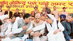 The Minister of State for Science and Technology and Industrial Training, Mr Rakesh Pandey, has a word with the Deputy Chief Minister, Ms Rajinder Kaur Bhattal, at a function organised in the memory of his father, the late Joginder Pal Pandey, in Ludhiana on Wednesday. 