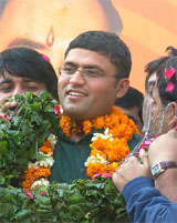 Ashok Tanwar, newly appointed President of the Indian Youth Congress, is welcomed by Congress workers as he arrives to take charge in New Delhi on Wednesday.