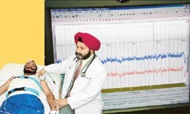 Dr H.J. Singh examines a sleep disorder patient at a sleep lab in Jalandhar