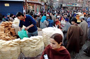 A market bustles with people, out on Id shopping, on Thursday in Srinagar. 