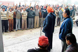 Members of the Uttariya Railway Mazdoor Union demonstrate in Ludhiana on Friday