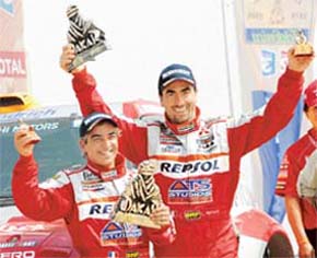 Frances Stephane Peterhansel retained the car rally title to add to the six motorcycle crowns he won in the 1990s