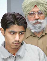 Shekhawat Ali, who was caught with pirated CDs and blue films, in police custody in Chandigarh on Saturday. 