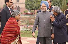President A.P.J. Abdul Kalam greets Gursharan Kaur as Prime Minister Manmohan Singh looks on during the At Home at Rashtrapati Bhavan in New Delhi on Saturday.