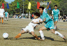 Manoj of the Chandigarh Football academy clears the ball in the semifinal match against Sanjay Public School, Chandigarh, on Sunday.